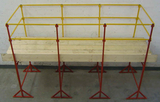 A yellow metal railings and a bench

Description automatically generated with medium confidence