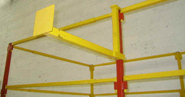 Yellow metal bars on a wall

Description automatically generated