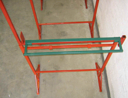 A red and green metal rack

Description automatically generated