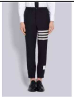 A person wearing black pants with white stripes

Description automatically generated